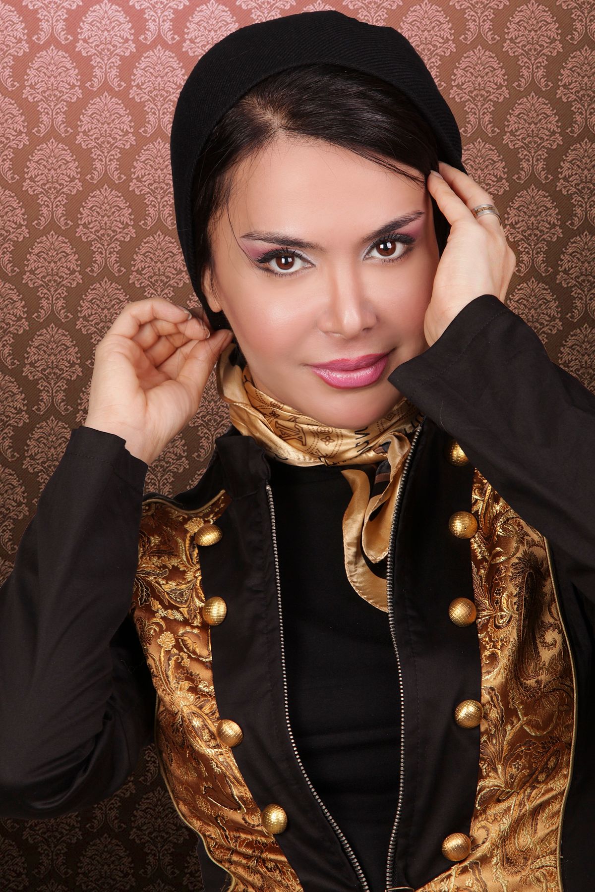 Studio portrait of Shiva Boloorian in a brocade jacket
