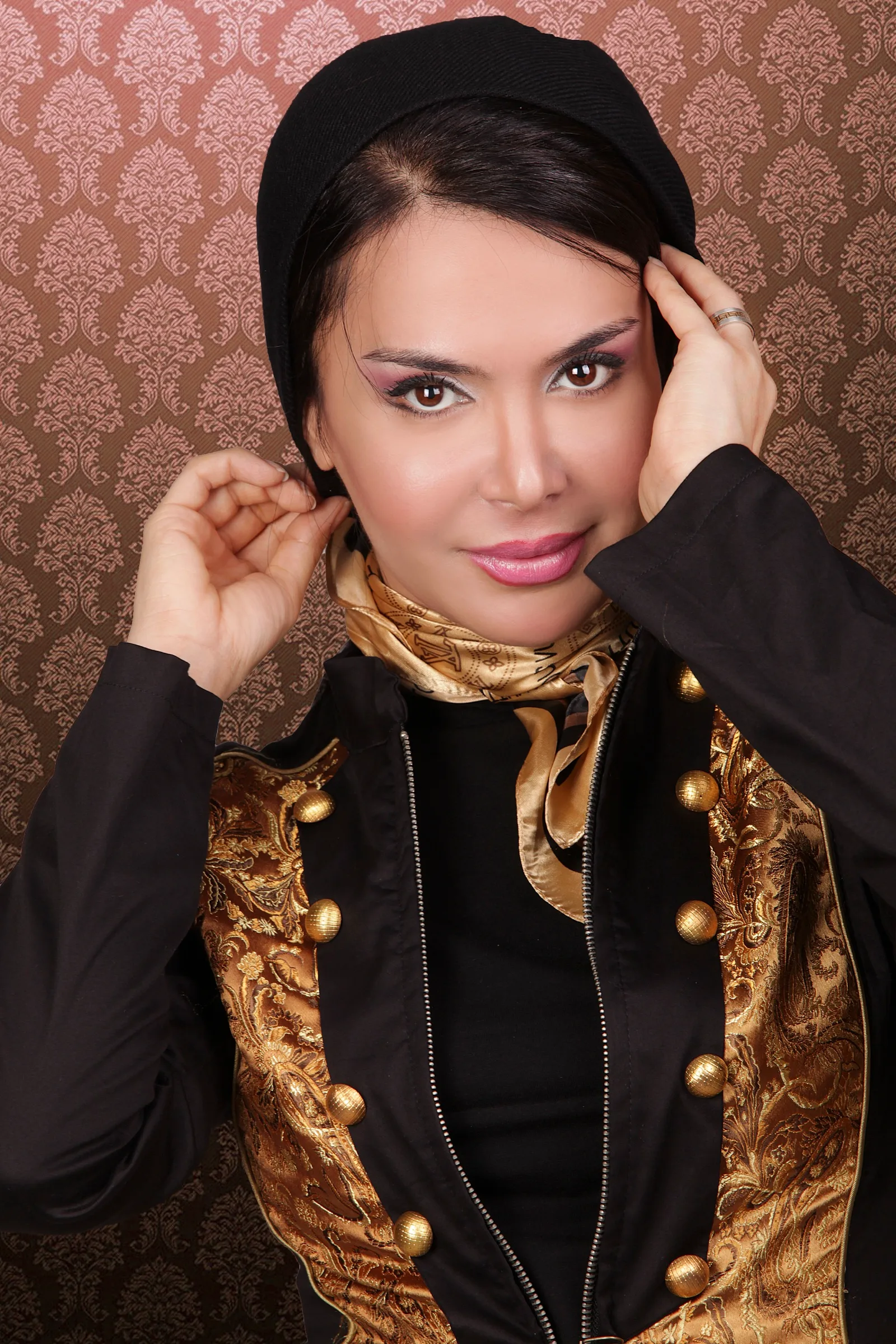 Studio portrait of Shiva Boloorian in a brocade jacket